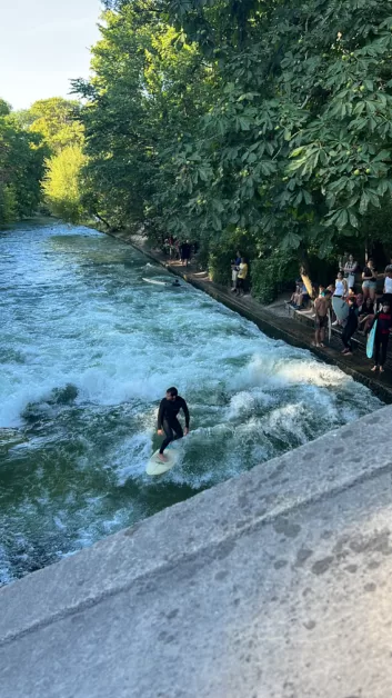 men surfing in English Garden Park from Munich